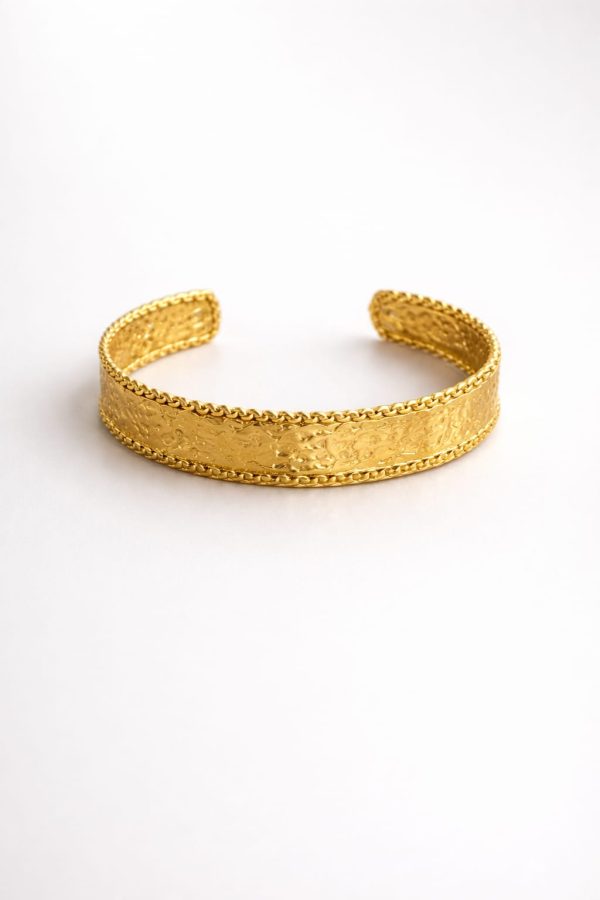 Pulsera diseño texturizado bordes dorado
