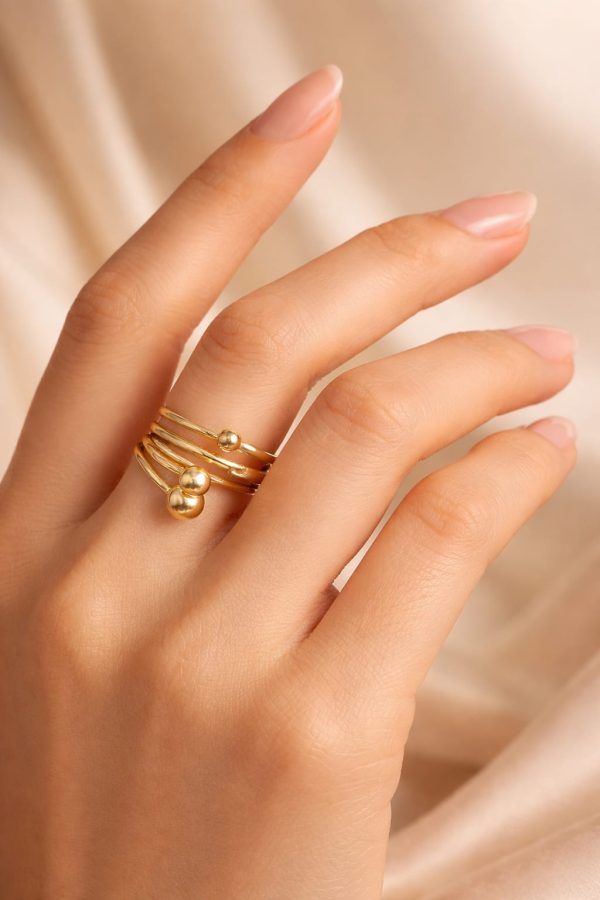 Anillo diseño en bandas esfera golfi dorado