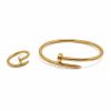 Juego pulsera y anillo clavo dorado
