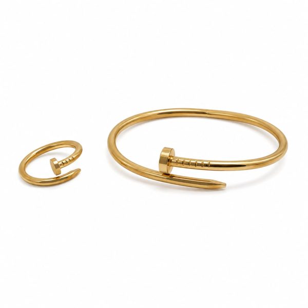 Juego pulsera y anillo clavo dorado