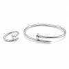 Juego pulsera y anillo clavo plateado